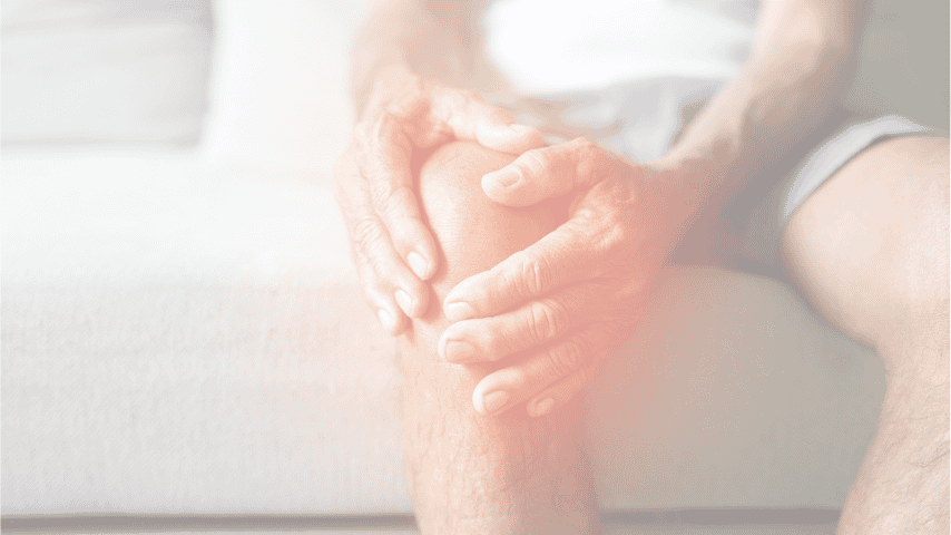 knee and hip 2 man holding inflamed knees with both his hands
